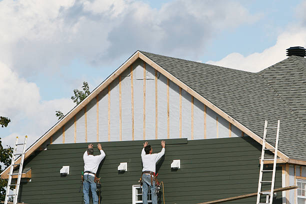 Professional Storm Damage Siding Repair technician working in Ripley, WV